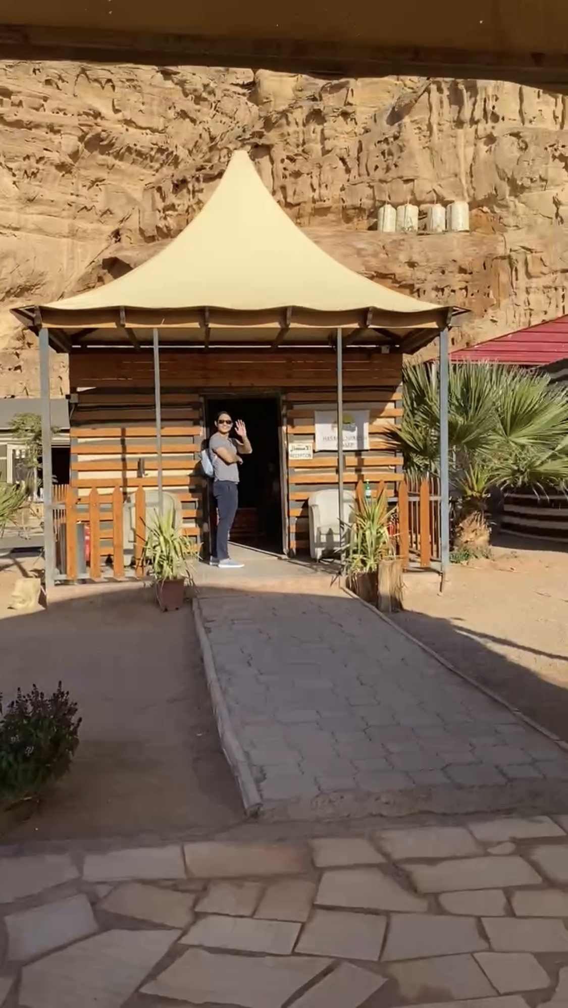 Me standing in front of the check-in shack