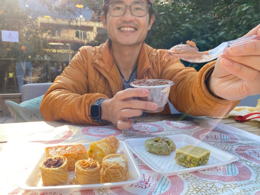 Me posing with a bunch of sweets from Sallouri Sweets shop